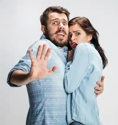 man and woman holding each other in fear about to need a pedestrial accident lawyer.