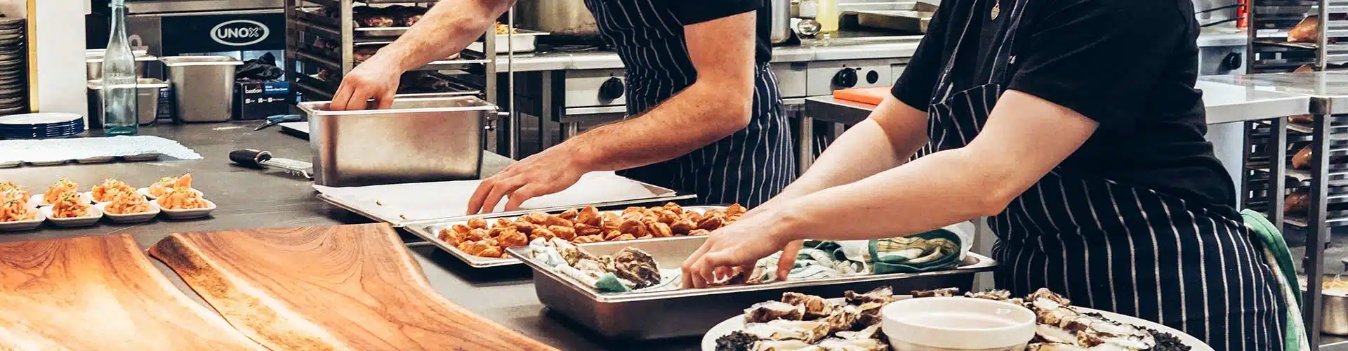 kitchen workers prepping food