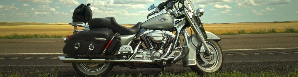 side view of motorcycle with motorcyclist in need of motorcycle accident lawyer