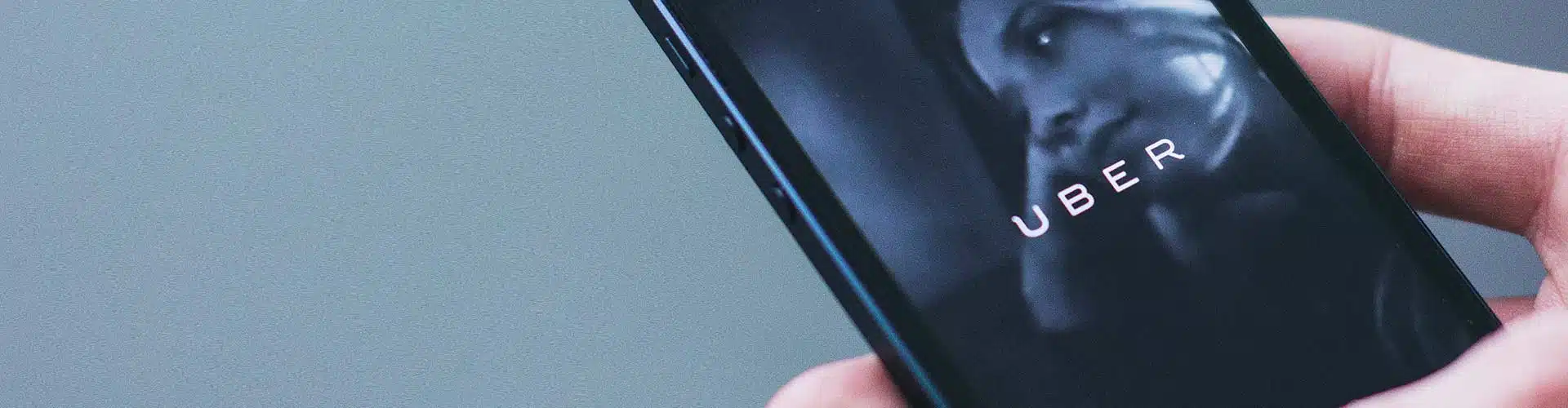 Uber logo on smart phone screen