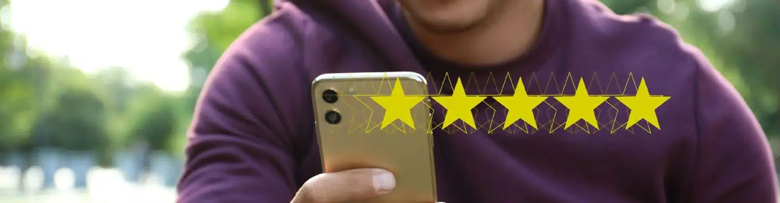 Man leaving reviews on his phone.